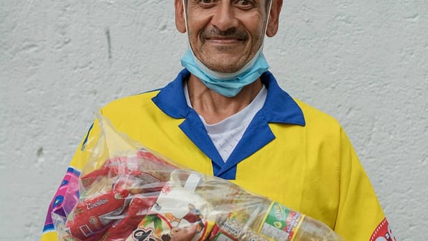 man happy with food bag