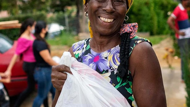 woman happy with food bag